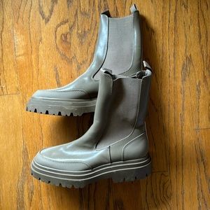 Rubber combat boots.